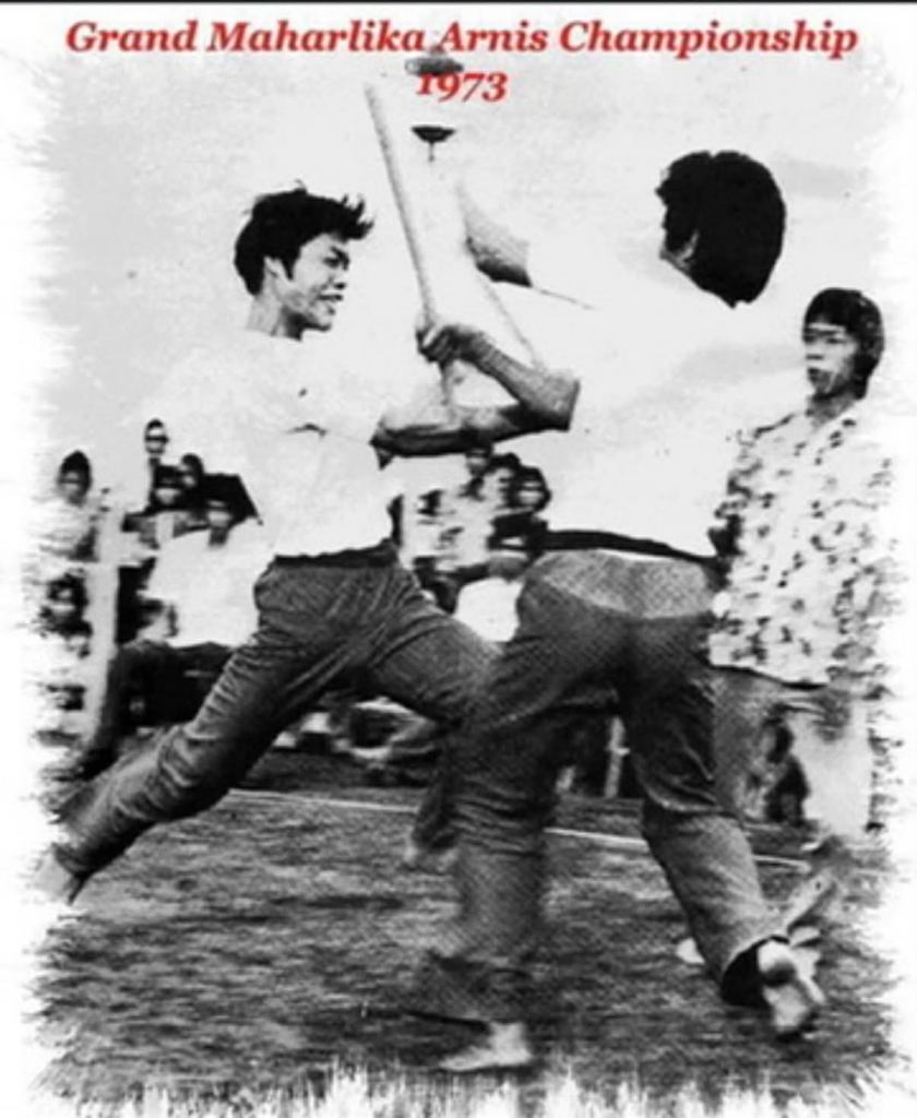 Two participants engaging in a martial arts sparring match during the Grand Maharika Arnis Championship in 1973.